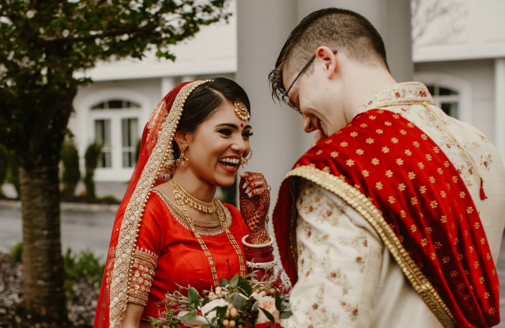 Happy Indian bride rejoice on the day of their wedding with groom